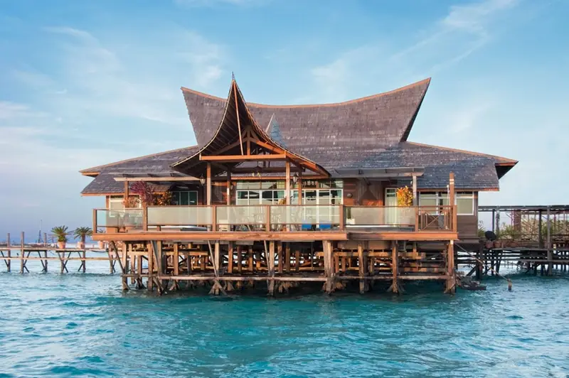 Royale Villa Suite at Mabul Water Bungalows: large timber villa on stilts over the sea